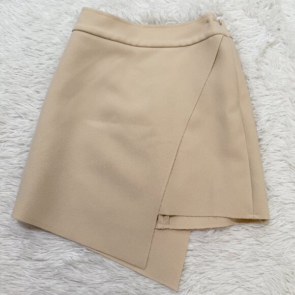 Topshop Dresses & Skirts - Women TOPSHOP Crepe Asymmetrical Hem Faux Wrap Mini Skirt in Ivory Size 2